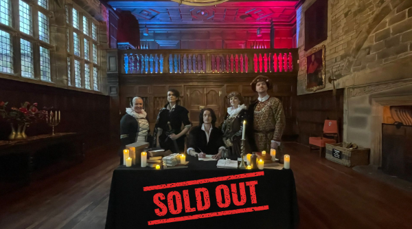 Shakespeare's Starcrossed Sold Out Actors stood in the Banqueting Hall at Hoghton Tower dressed in Shakespearian outfits for the Shakespeare's Starcrossed event with sold out banner.