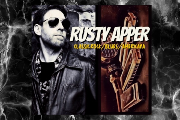 Image showing a picture of Rusty Apper with his name and Classical Rock Concert on a dark smokey background.