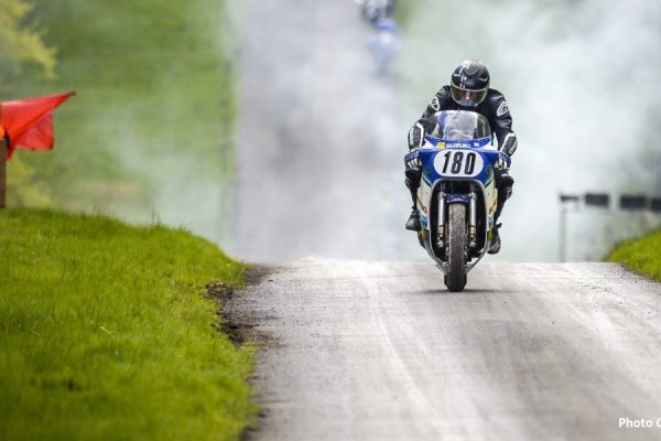 Motorcycle competitor with number 188 racing up the hill at Hoghton Tower for their annual motorcycle sprint race