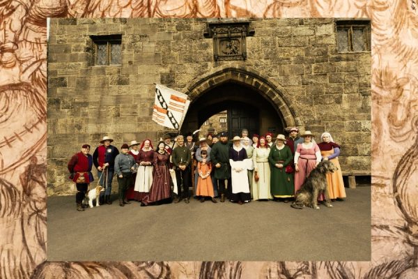 Medieval times background with Sir John Saville's Household stood in front of the tower