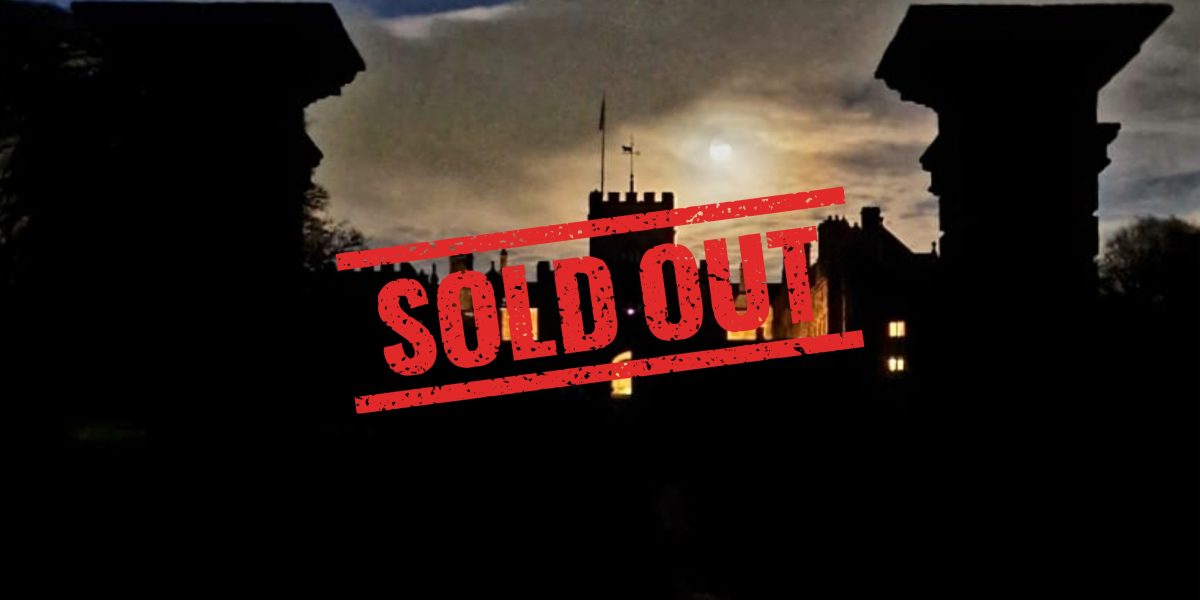 Picture of Hoghton Tower exterior in the dark with the sign sold out on it.