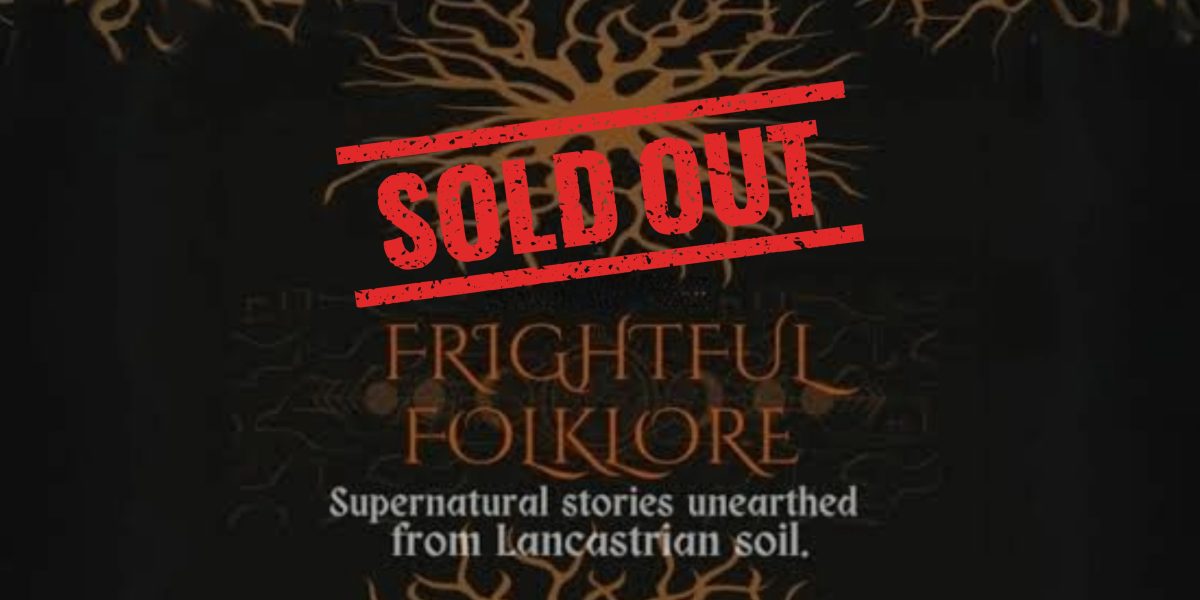 Frightful Folklore Sold Out Gothic-style lantern lighting a dark corridor at Hoghton Tower during the Frightful Folklore with sold out sign across in red